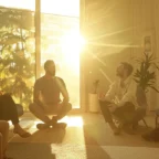 a group therapy session in a serene, sunlit room, with individuals sharing their stories and supporting each other on the journey to recovery.